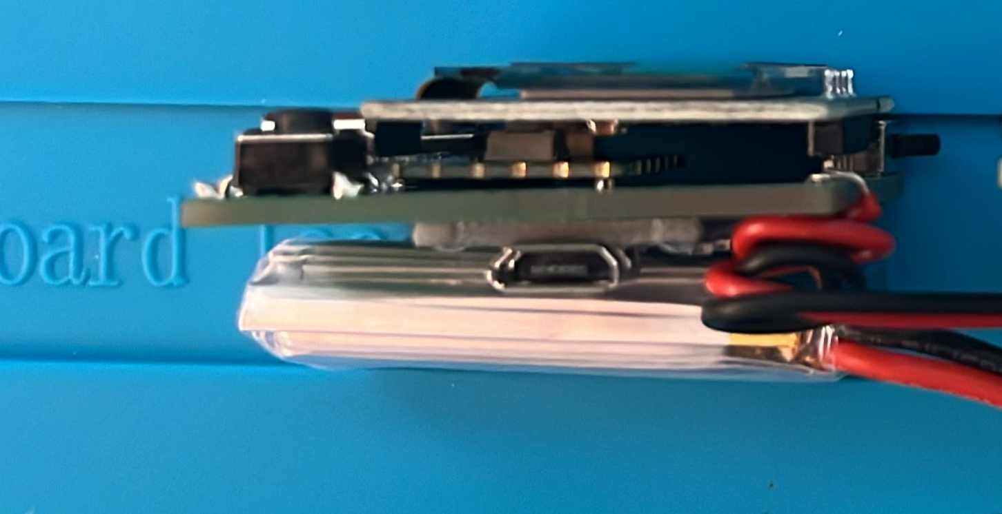 Side view showing the two MCU modules stacked on the carrier board.